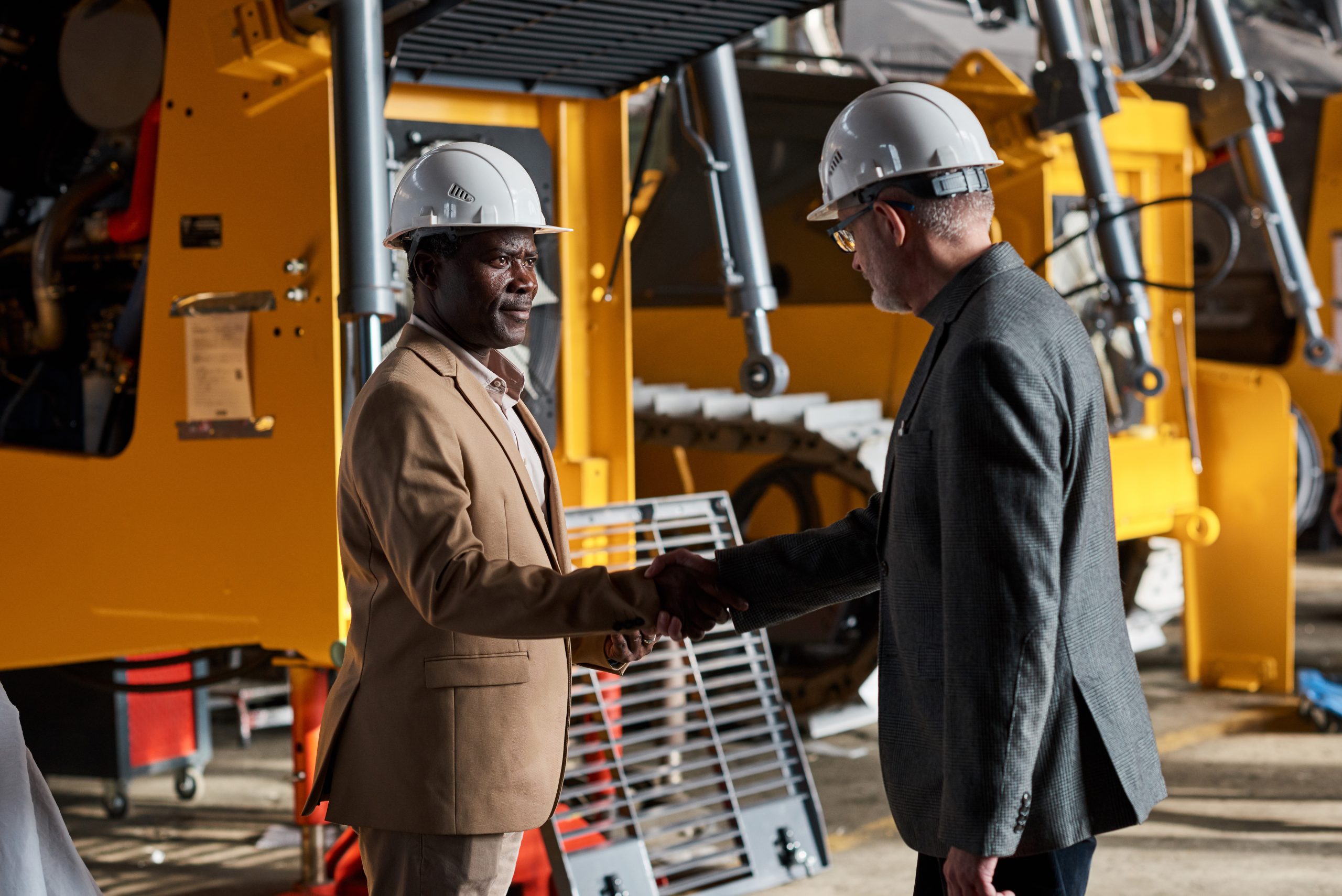 Engineering professionals collaborating at an industrial manufacturing plant